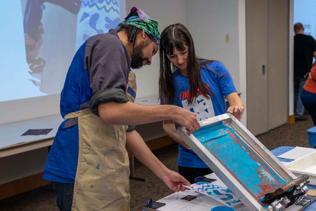 Students participating in a screen printing activity.