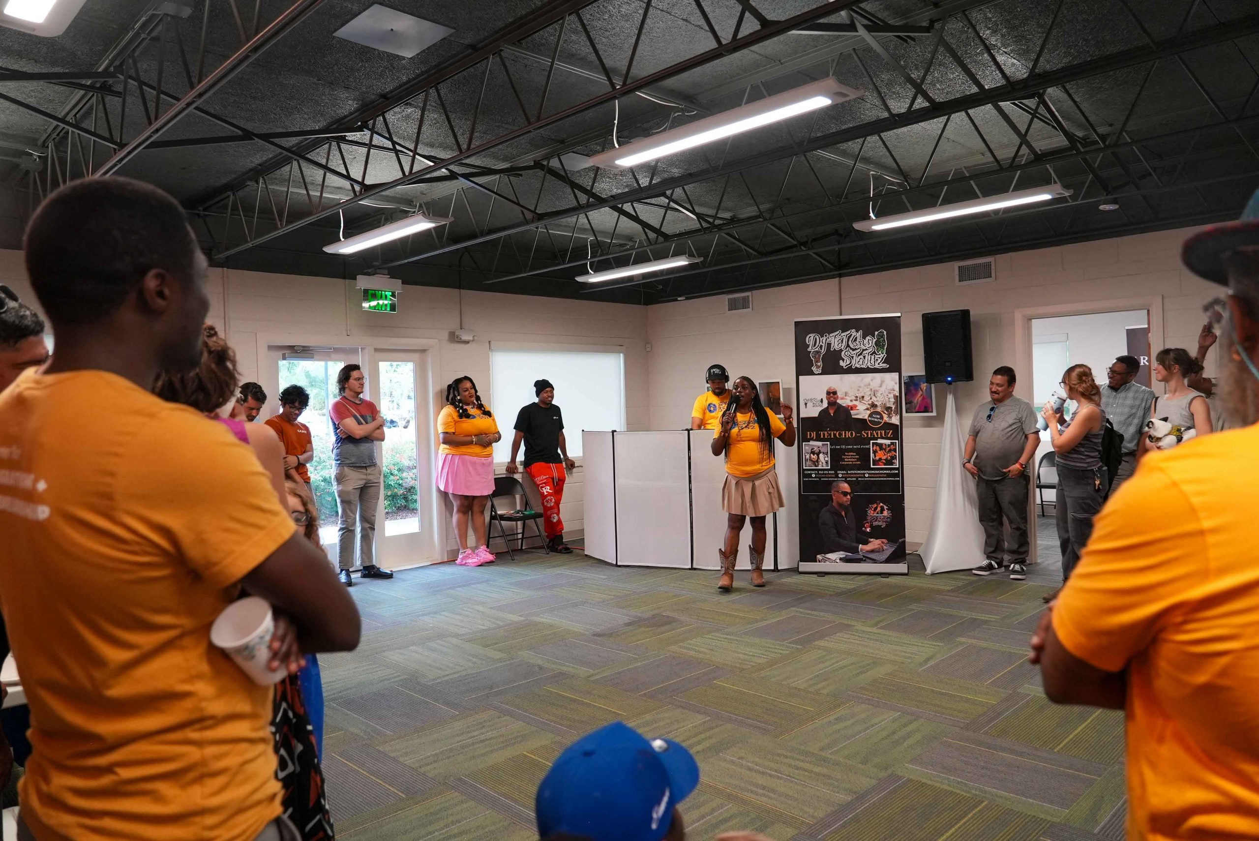 group of people around a speaker in oak view studios