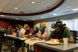 Participants writing in a workshop